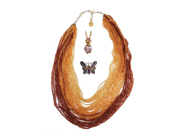 Multi-strand necklace and two animal brooches