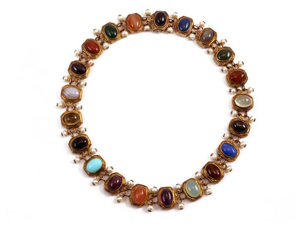 Golden silver necklace with pearls and various stones