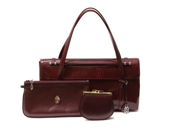 Cartier - Shoulder bag in burgundy patent leather