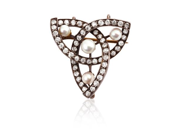 Yellow gold and silver brooch with diamonds