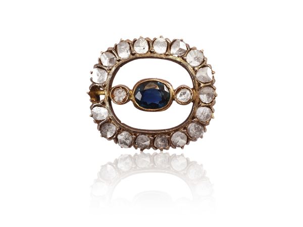 Low title yellow gold and silver scarf-clip with diamonds and sapphire