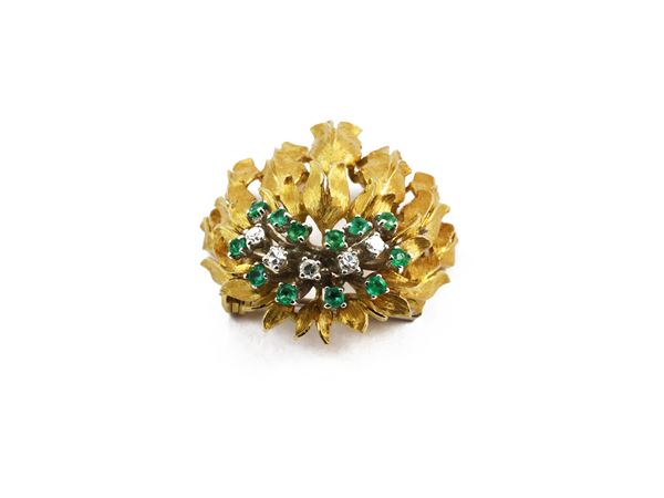 Floral yellow gold brooch with diamonds and emeralds