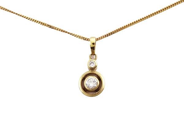 Yellow gold solitaire necklace with diamonds