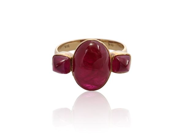 Yellow gold ring with glass filled rubies