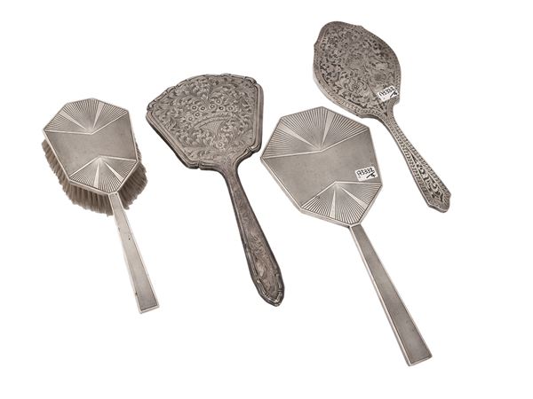 Three mirrors and a hand brush covered n silver