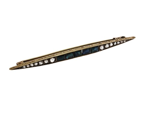 Yellow gold and silver barret brooch with synthetic sapphires and diamonds