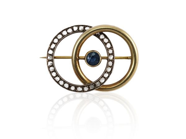 Yellow gold and silver bouble circle brooch with sapphires and diamonds