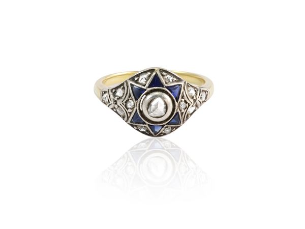 Solitaire ring in yellow gold and silver with diamonds and sapphires
