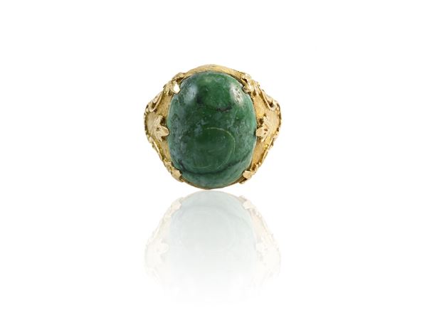 Yellow gold engraved ring with green stone