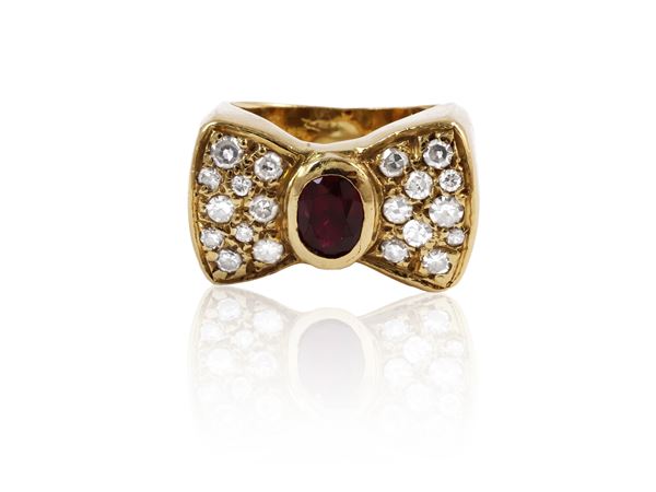 Yellow gold bow ring with ruby and diamonds