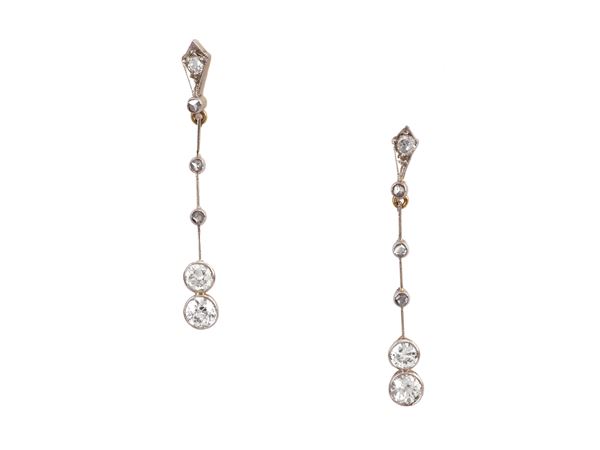 Yellow gold and platinum pendant earrings with diamonds