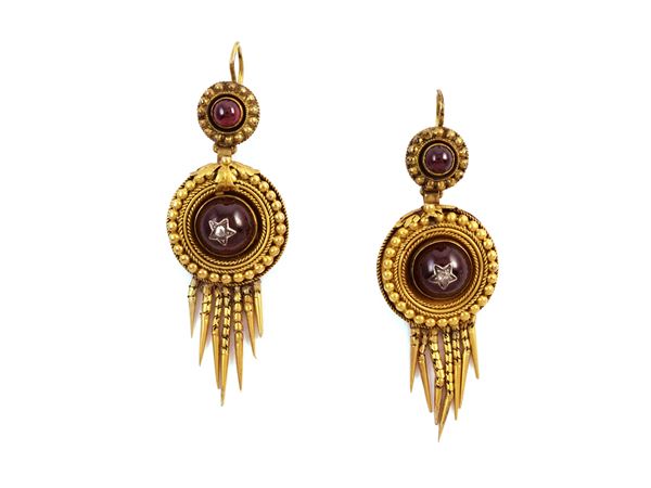 Victorians earrings in low -titled yellow gold with garnets and diamonds