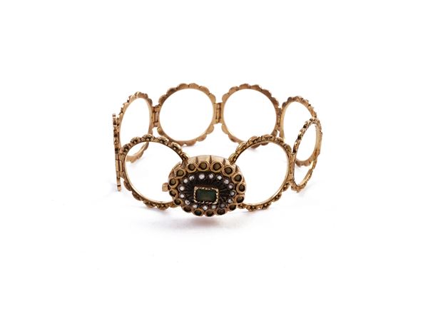 Ring transformable into bracelet in low title yellow gold and silver with diamonds and emerald