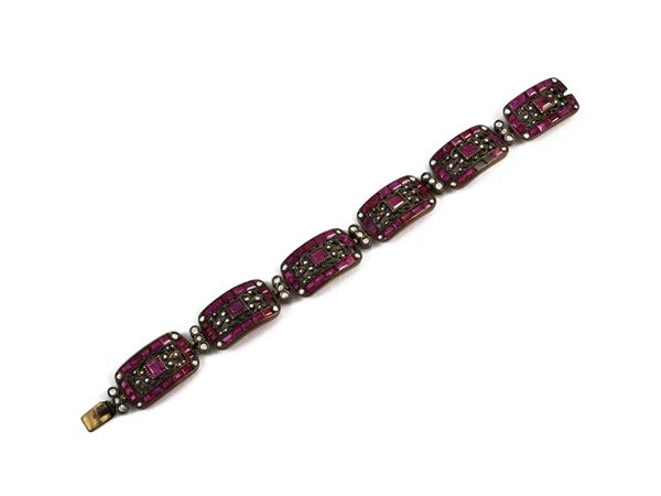 Silver and low title yellow gold bracelet with rubies and diamonds