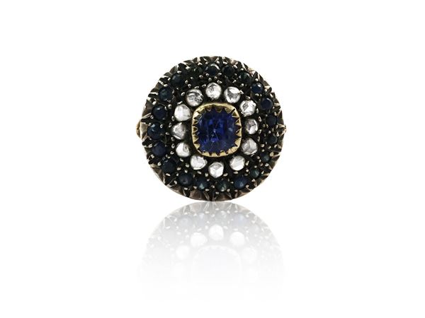 Yellow gold and silver ring with sapphires and diamonds