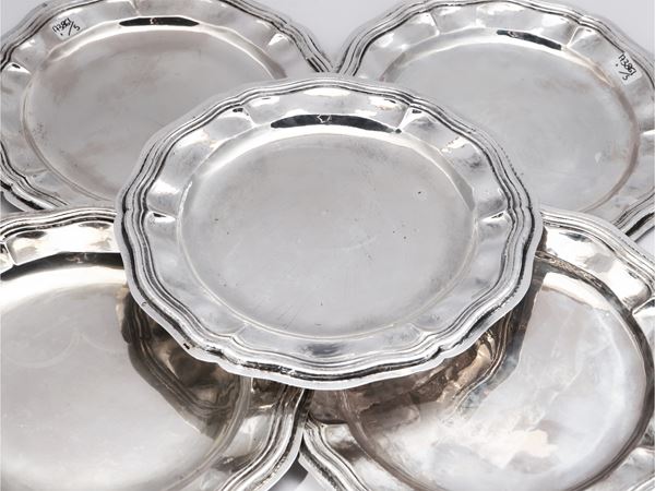 Serie di cinque piattini in argento