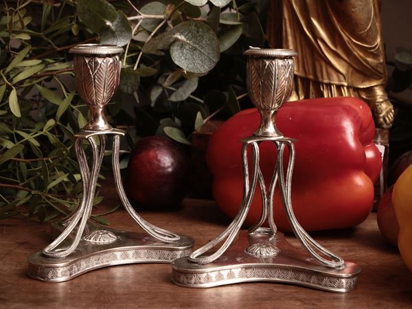 Coppia di candelieri in argento
