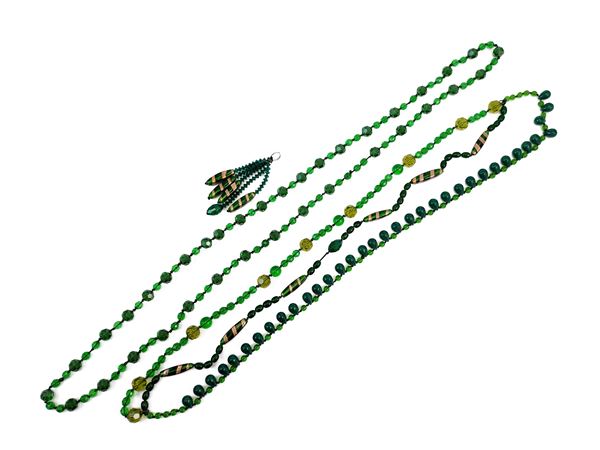Two long necklaces and a green glass pendant