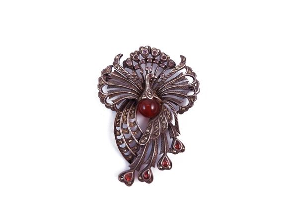 Animal brooch in burnished metal