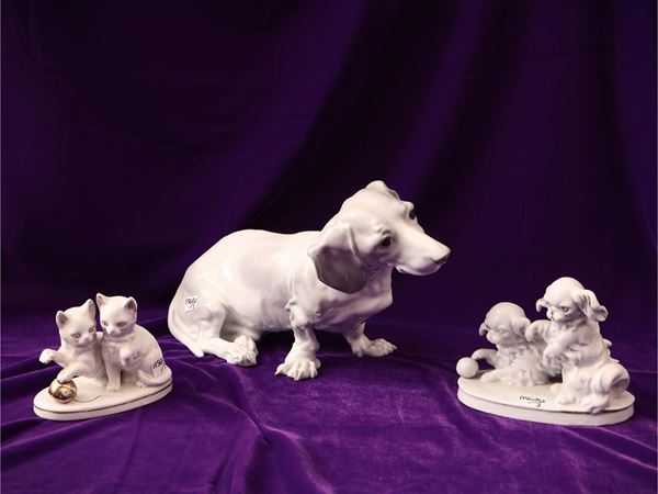 Three animal groups in white porcelain