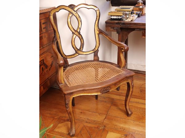Pair of gilded wooden armchairs