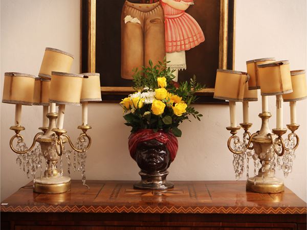 Pair of carved wooden holder, white and golden lacquered