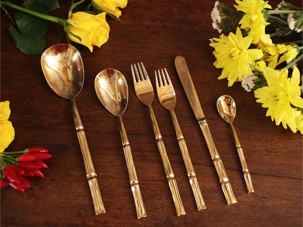 Golden metal cutlery service