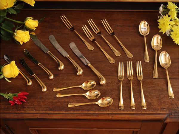 Golden metal cutlery service