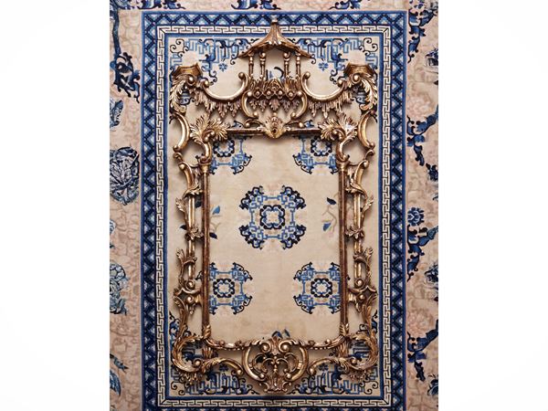 Large carved and golden wooden frame