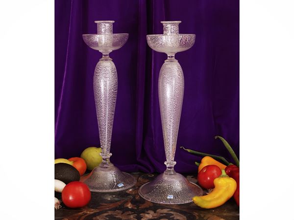 Pair of colorless puffed glass candlesticks