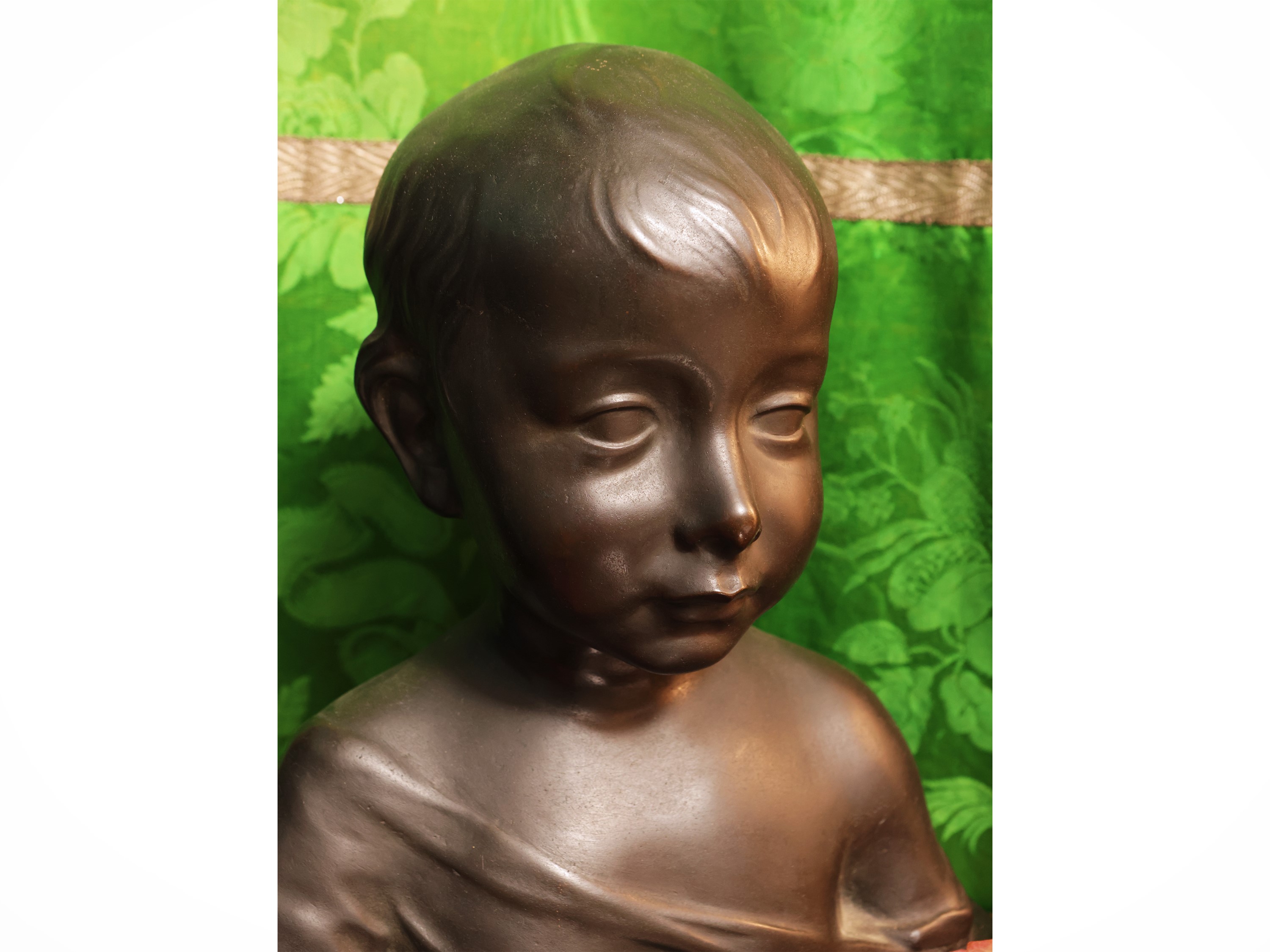 Donatello, Testa di bambino in bronzo su base in marmo