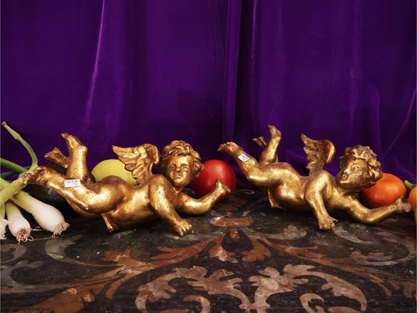 Series of four carved and golden wooden cherubs