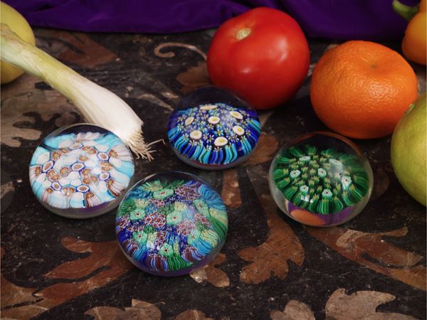 Series of four small press-papiers in blown glass
