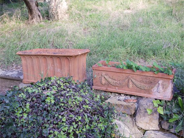 Seven terracotta box vases