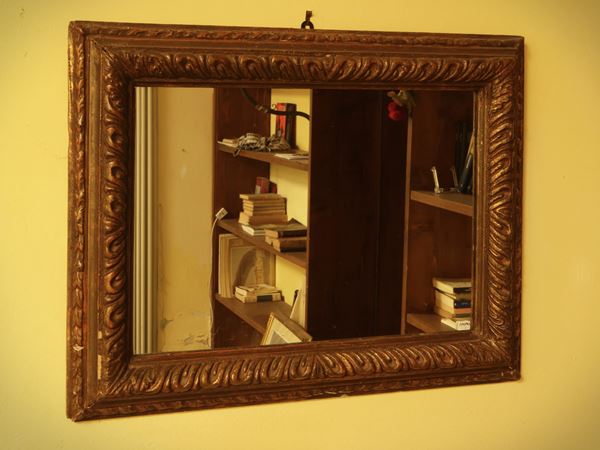 Mirror with wooden frame and golden tablet