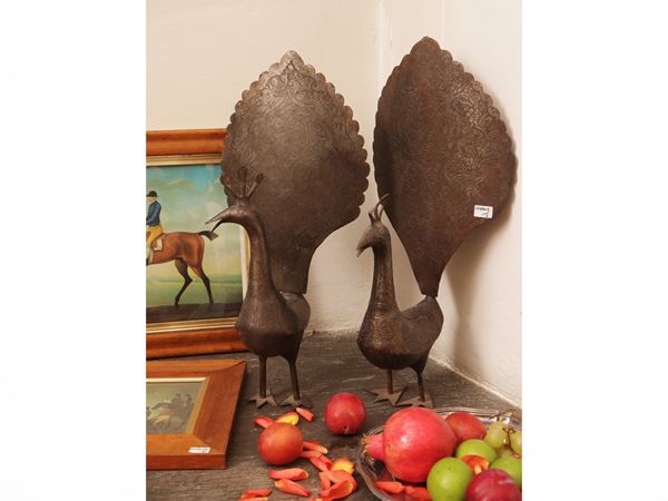 Pair of burnished and gilded iron peacocks