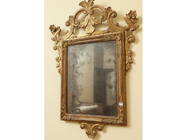 Carved and golden wood mirror