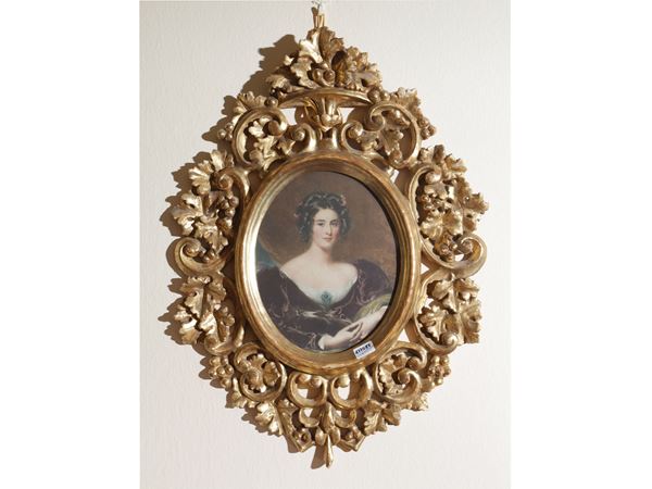 Carved and golden wooden frame