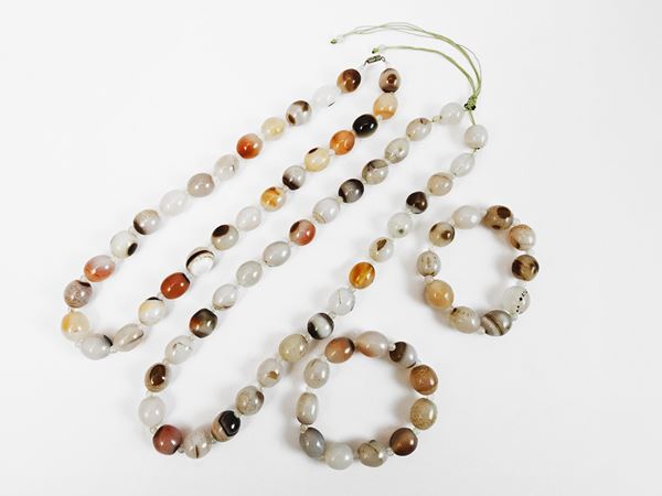 Due demi parure di agate policrome