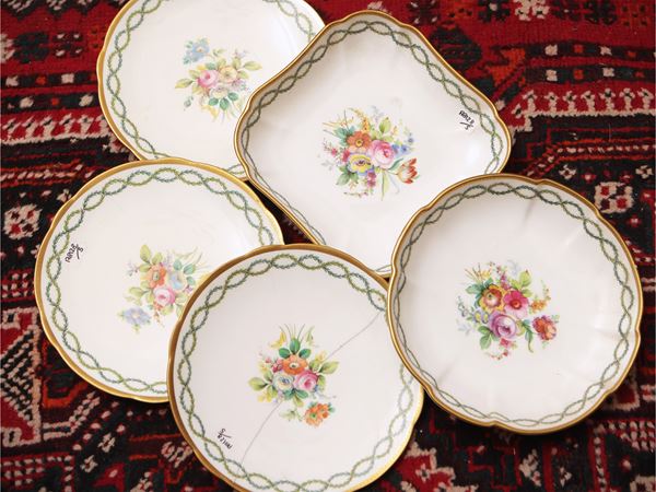 Series of five painted porcelain plates
