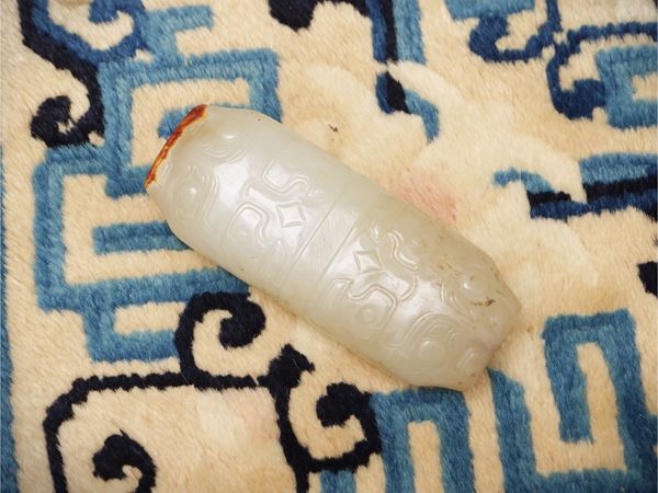 A greyish-green jade archaistic intaglio with taotie motifs, China, Qing dynasty, 18th-19th century