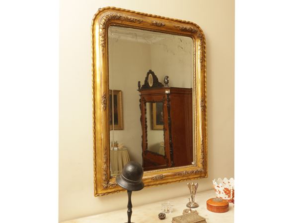 Curved mirror with golden tablet frame