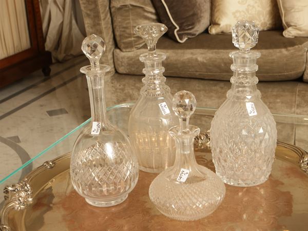 Four crystal wine bottles