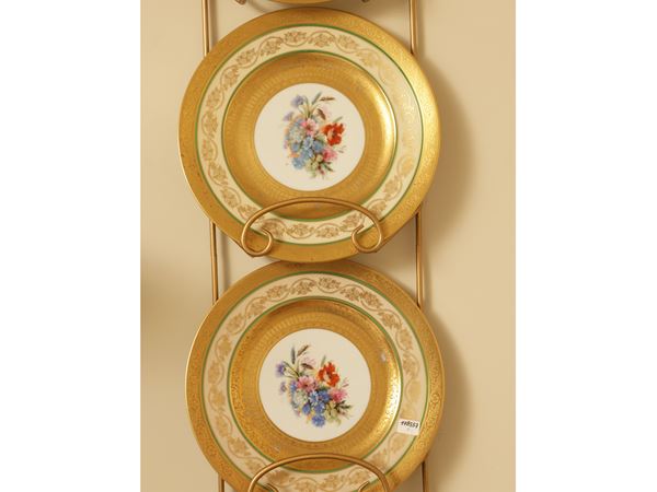 Series of four decorative plates in German porcelain