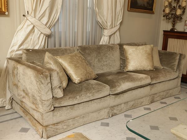 Padded three-seater sofa