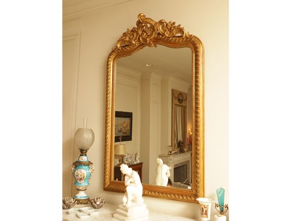 Carved and gilded wooden mirror