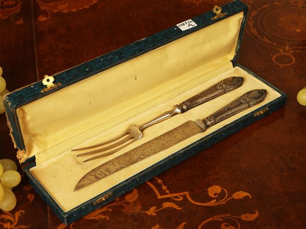 Two sets of serving cutlery