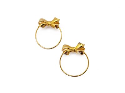 Orecchini a cerchio in metallo golden tone con fiocchi