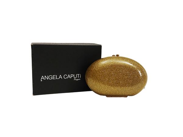 Angela Caputi - Clutch in resina color oro