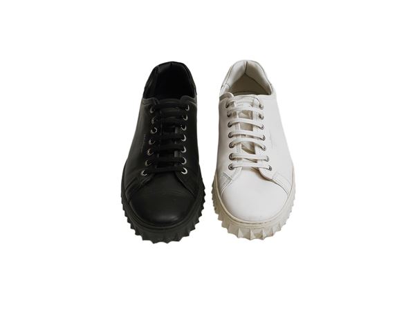 Salvatore Ferragamo - Sneakers da uomo in pelle una bianca l'altra nera